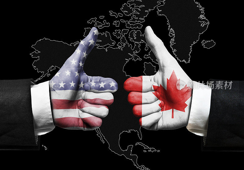 美国国旗和加拿大国旗hand over hand with Thumbs sign北美地图背景/国旗概念(点击查看更多)